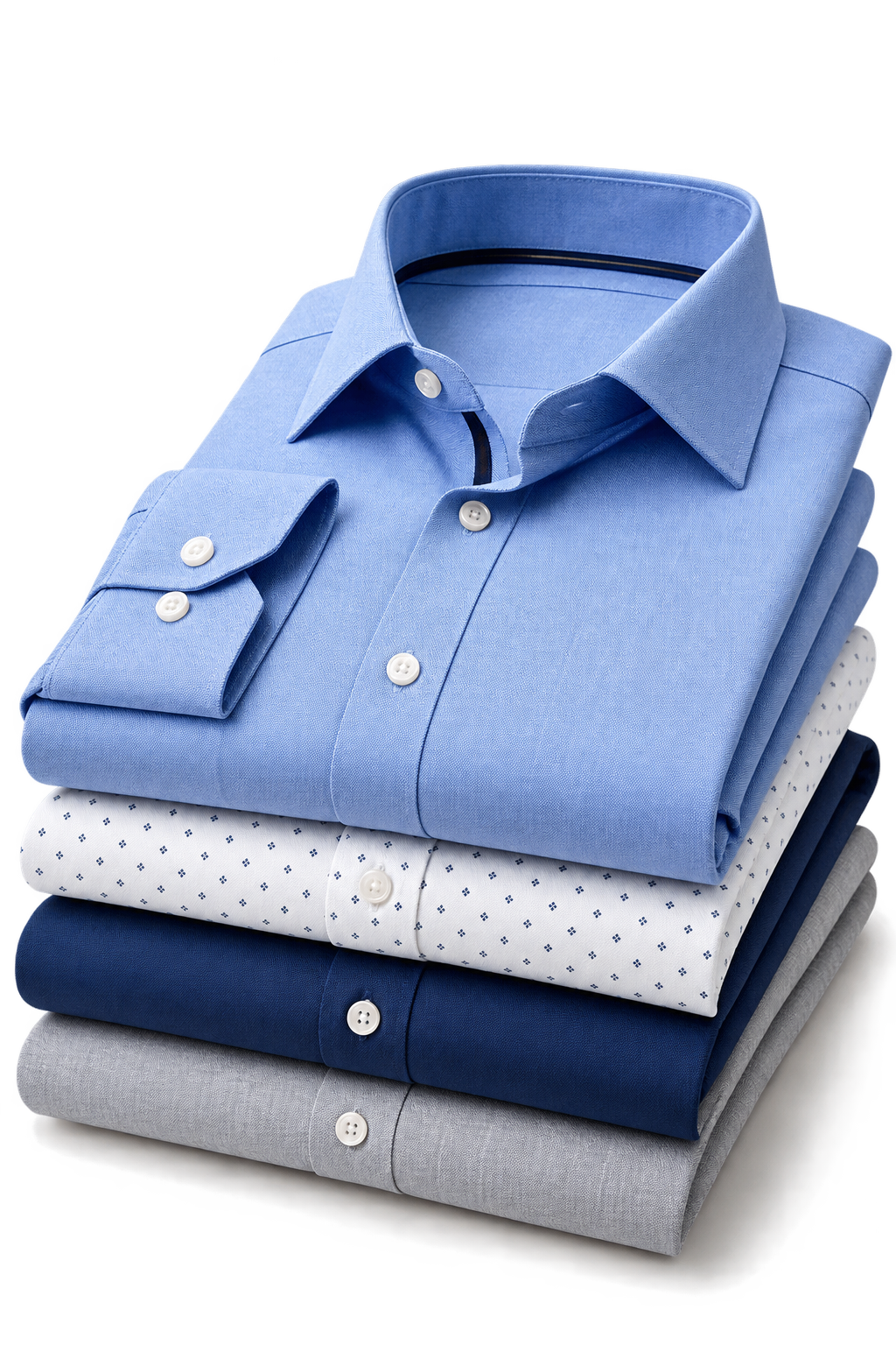 Stack of folded custom dress shirts in blue, white, navy, and grey